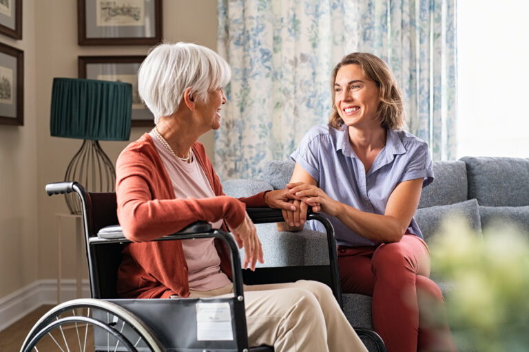 Mature woman talking with caretaker