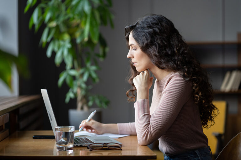 Client doing online research at laptop